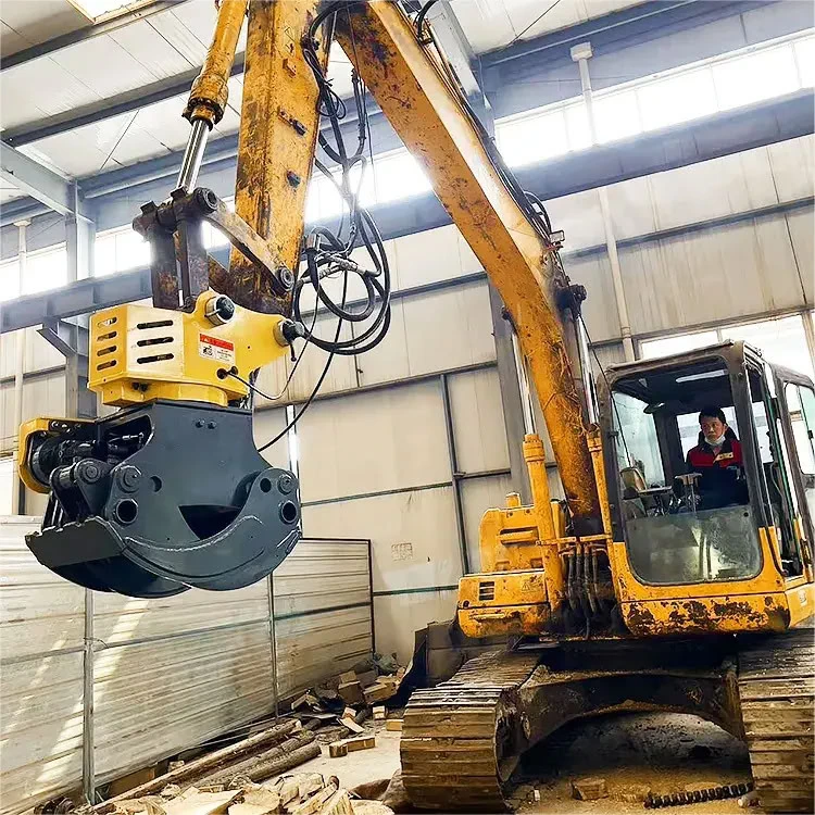 Yellow-shell grapple saw installed on an excavator in a workshop