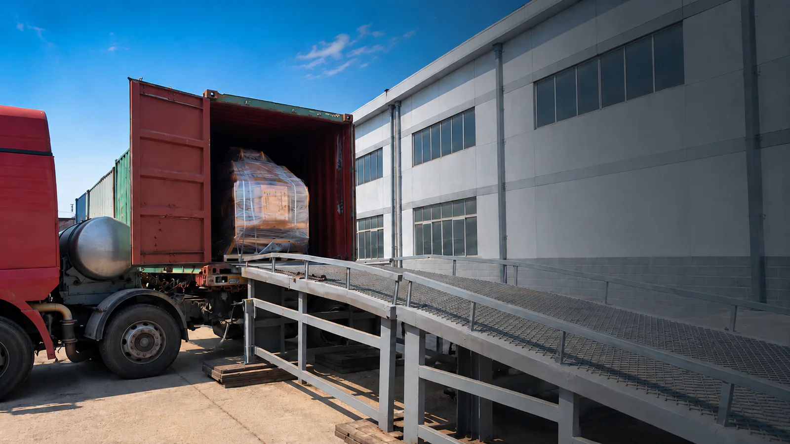 Attachment shipping preparation beside an industrial building
