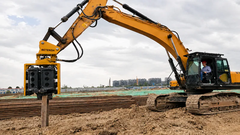 Excavator attachment working on prepared ground