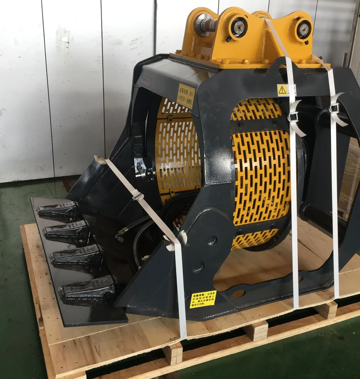 Real black and yellow Screening Bucket detail showing its frame, teeth and rotating screen drum